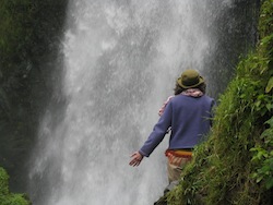 Helen facing the waterfall